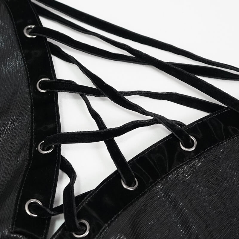 Close-up of black dress lacing with velvet straps and metallic eyelets for a gothic and stylish look.
