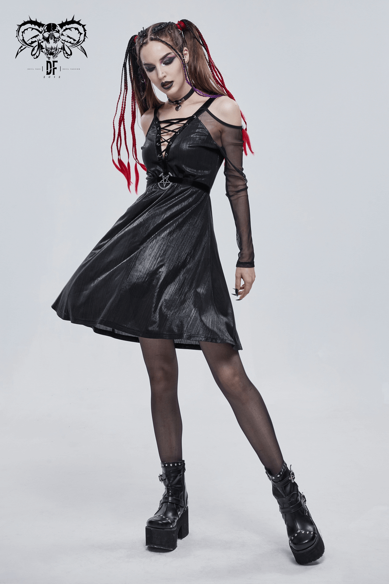 Model wearing a black off-the-shoulder gothic dress with a pentagram, stylish punk look and dramatic hair.