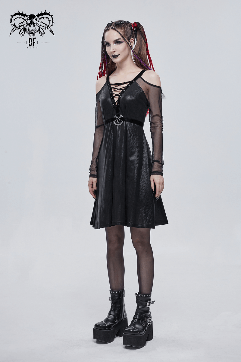 Model in a black sexy off-the-shoulder gothic dress with pentagram, showcasing a stylish look and trendy accessories.