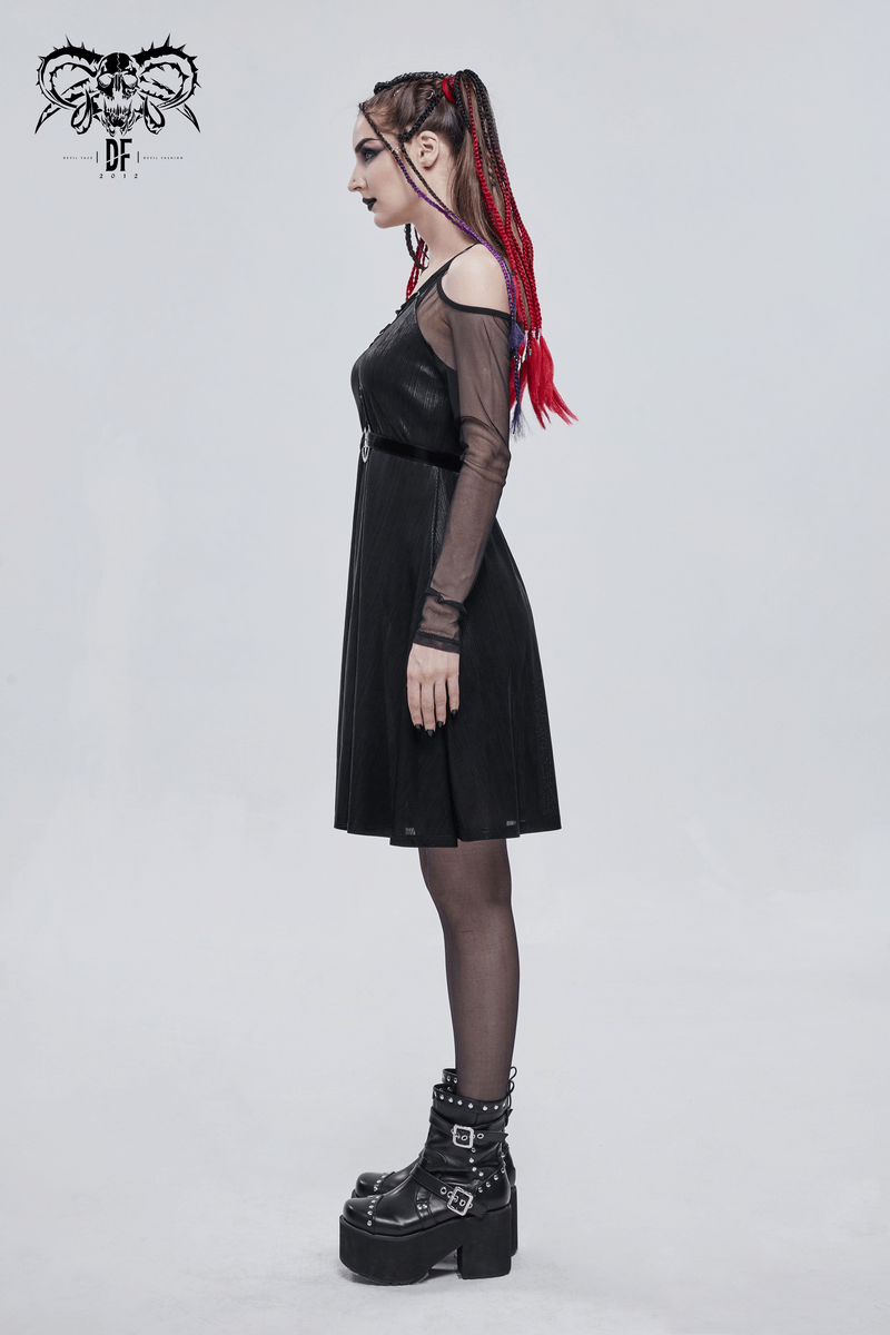 Profile view of a woman in a black off-the-shoulder long sleeve gothic dress with a pentagram, showcasing her edgy style.