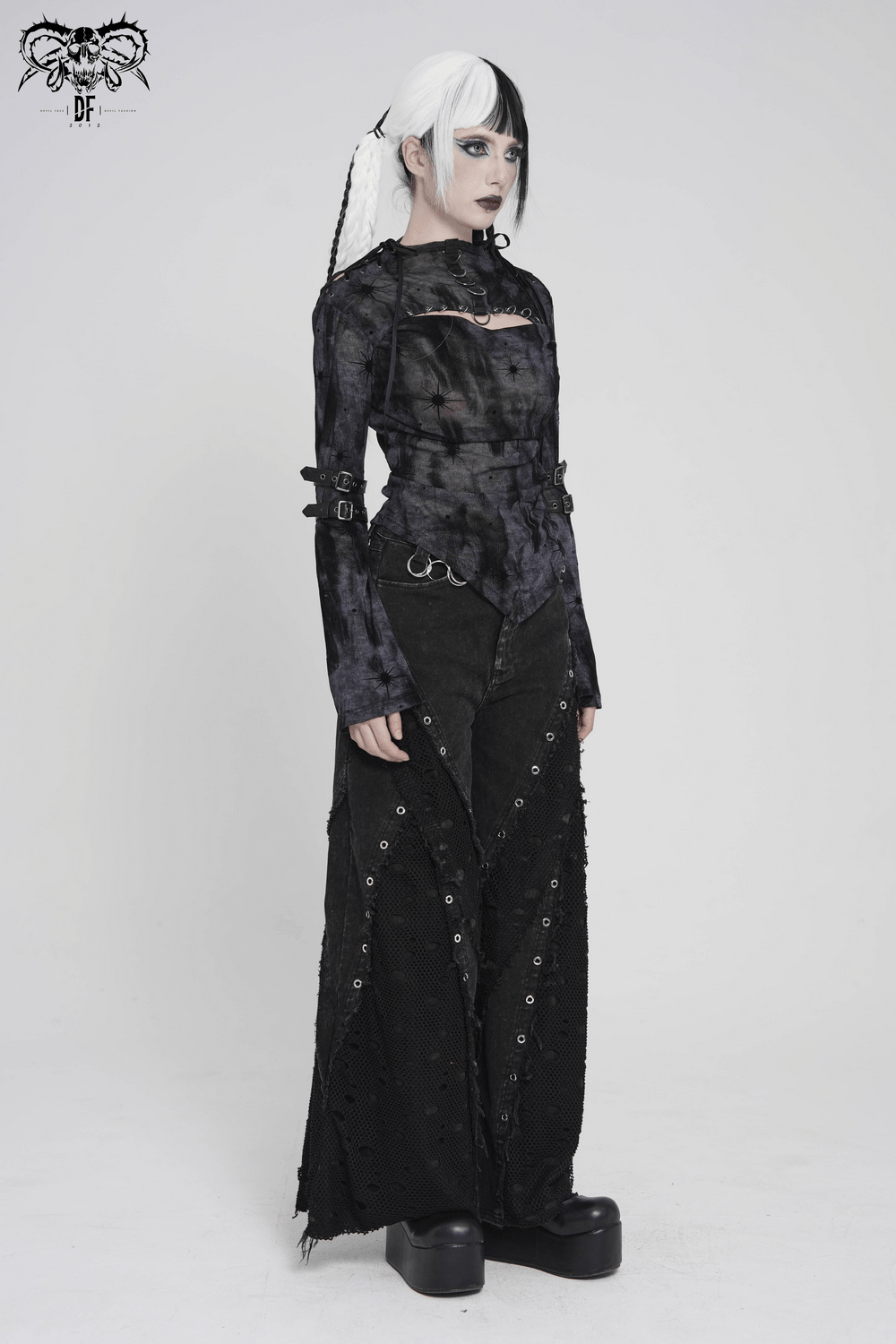 Black Sheer Gothic Mesh Top with Buckle Sleeve Straps worn with edgy pants and platform shoes.
