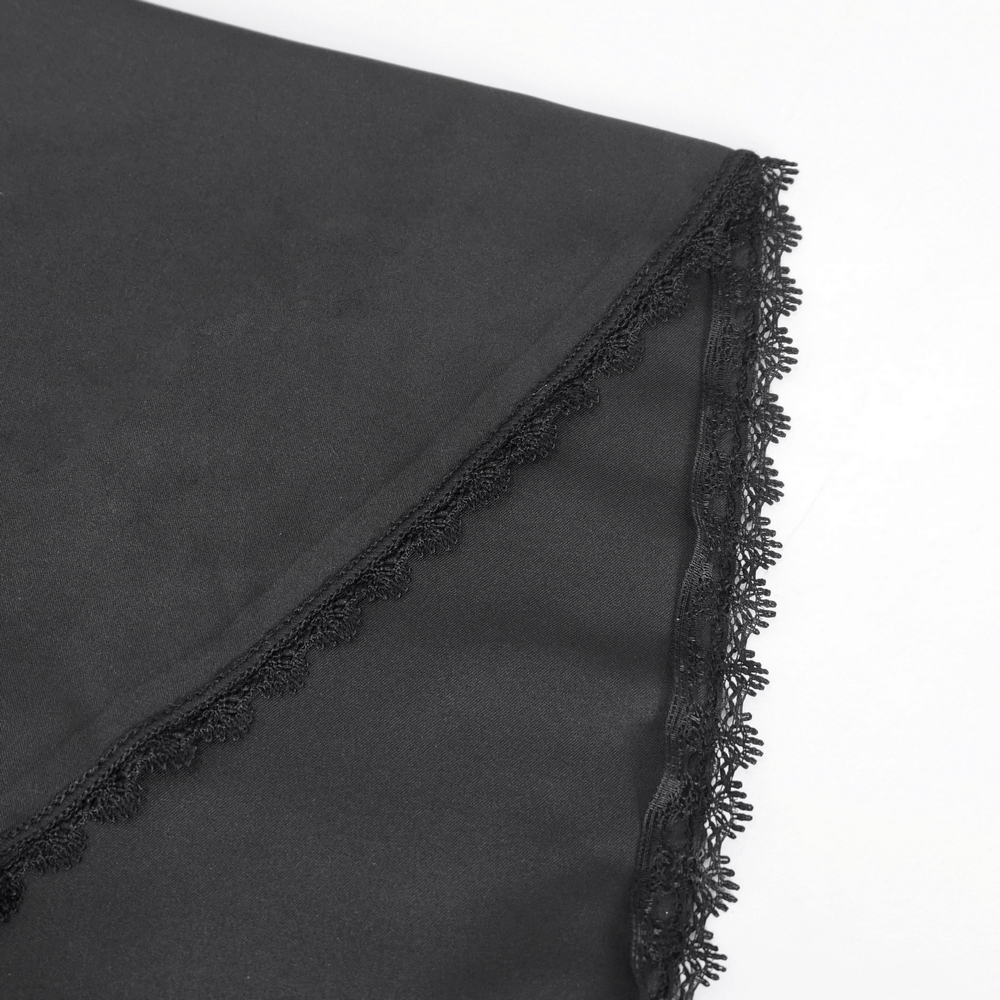 Close-up of black sheer lace fabric with scalloped edges, perfect for a gothic romantic look.