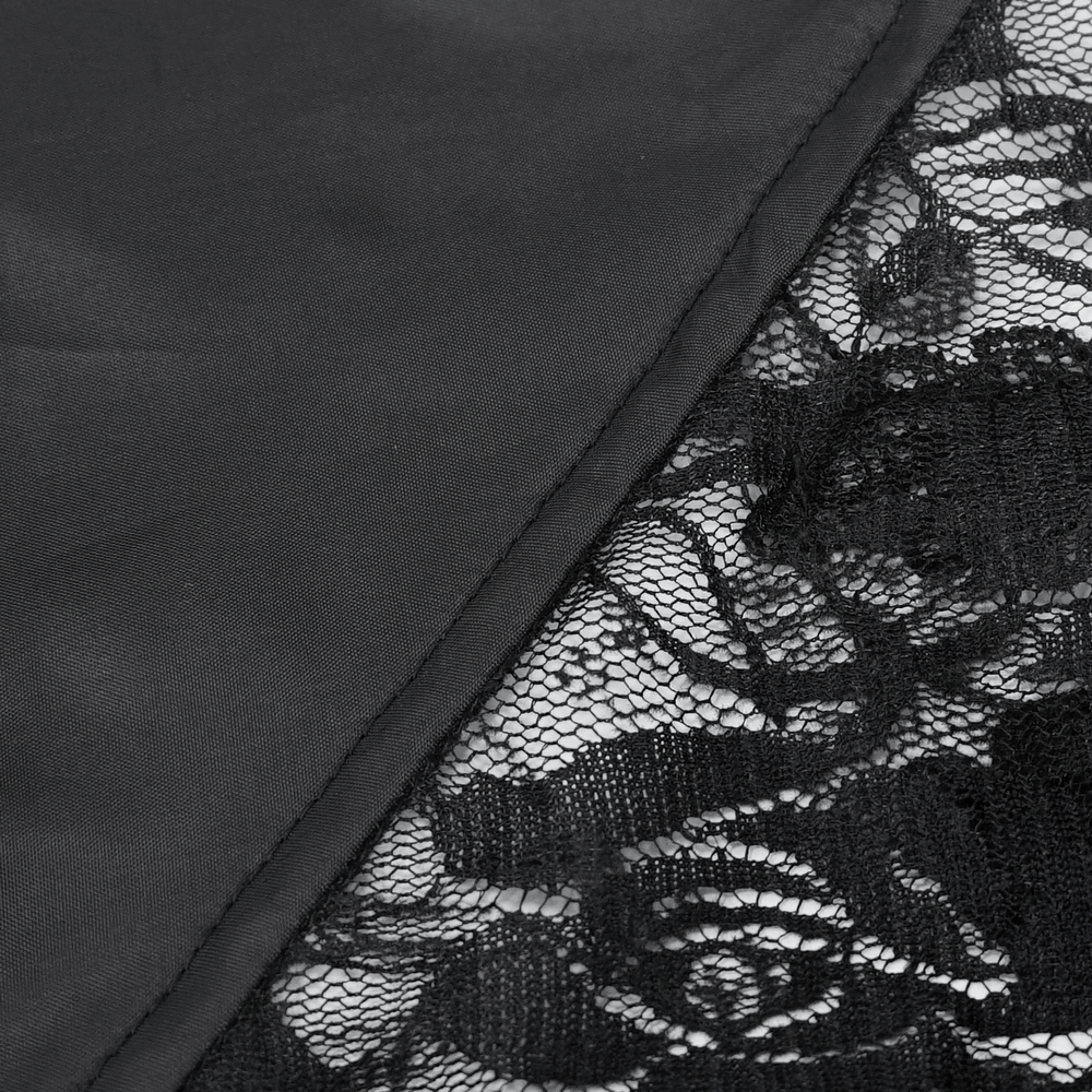 Close-up of black sheer lace fabric showcasing intricate patterns, perfect for gothic romance tops.