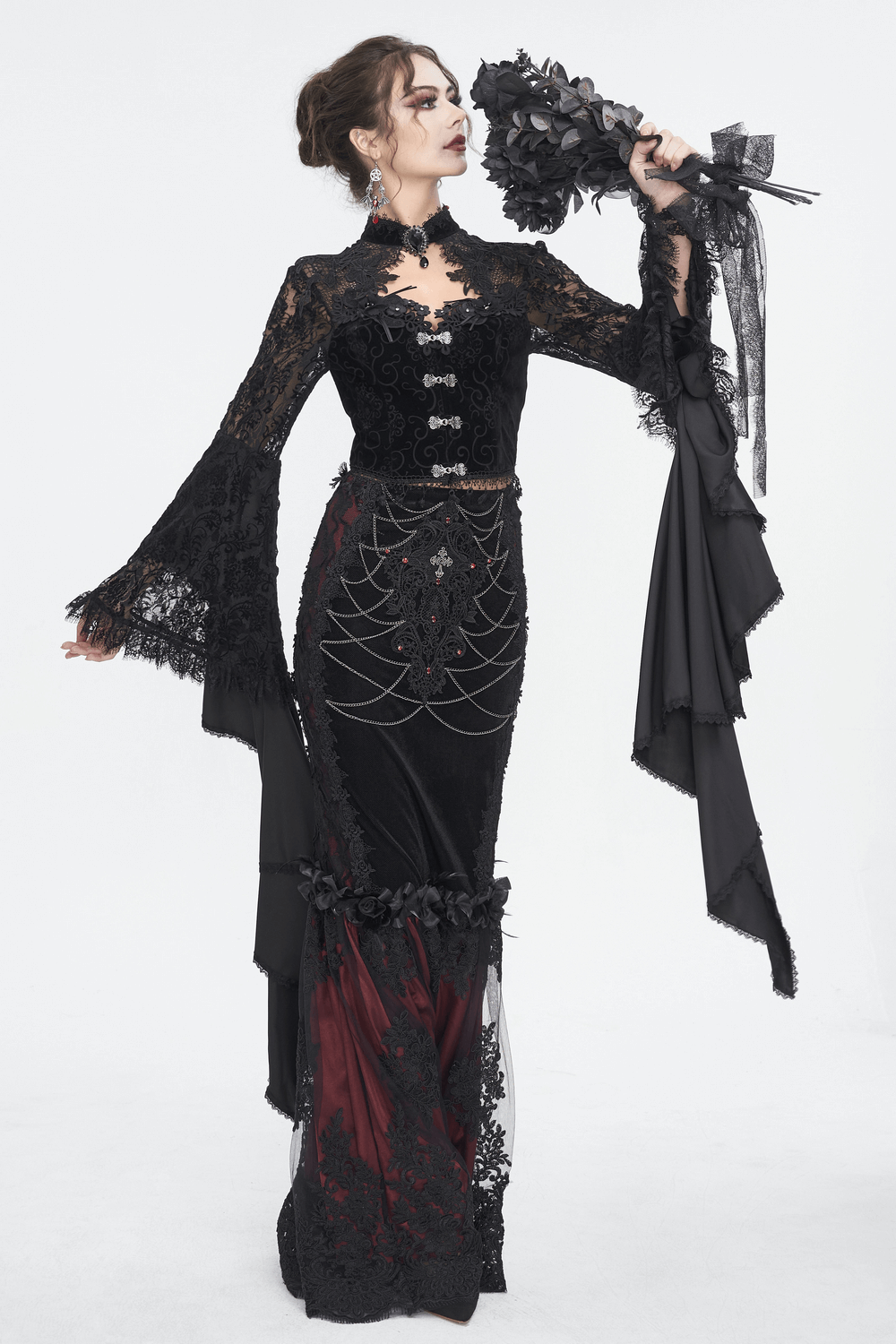 Gothic black lace crop top with long bell sleeves, paired with a dramatic skirt for a captivating look.