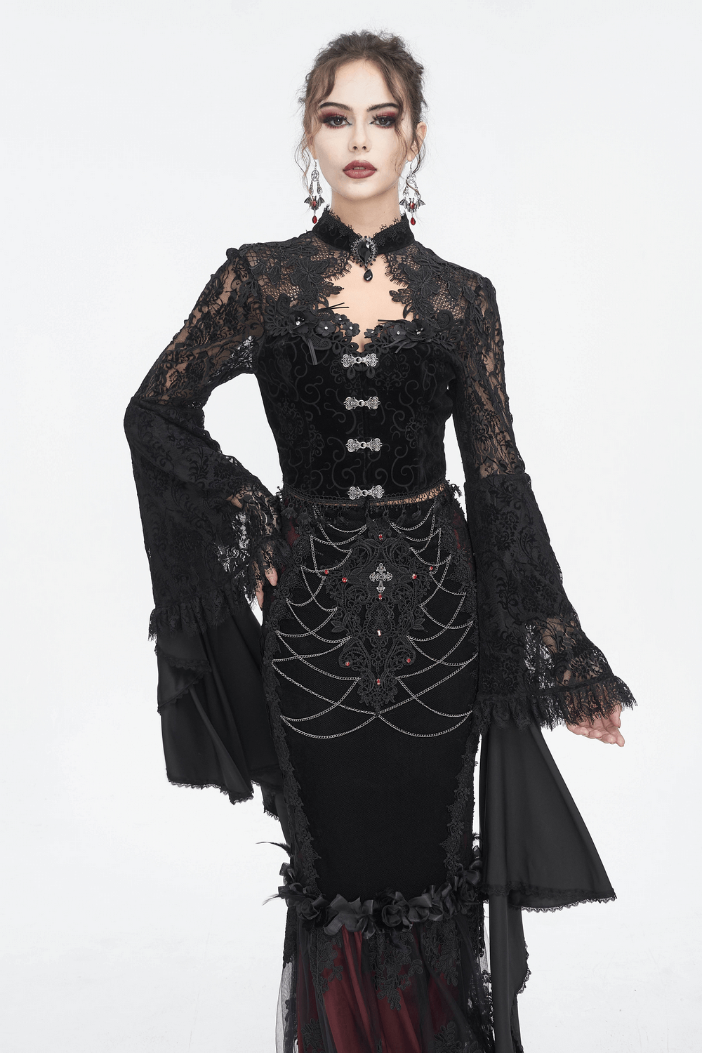 Elegant black lace crop top with long bell sleeves, scalloped neckline, perfect for gothic romance.