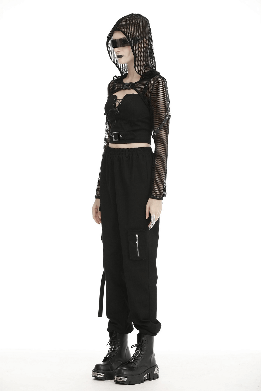 Model wearing a black sheer mesh hooded top with long sleeves, paired with black cargo pants and chunky boots.