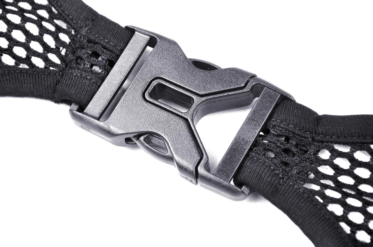 Close-up of a black fishnet buckle from a sheer mesh garment, showcasing its edgy design and functional fastening.