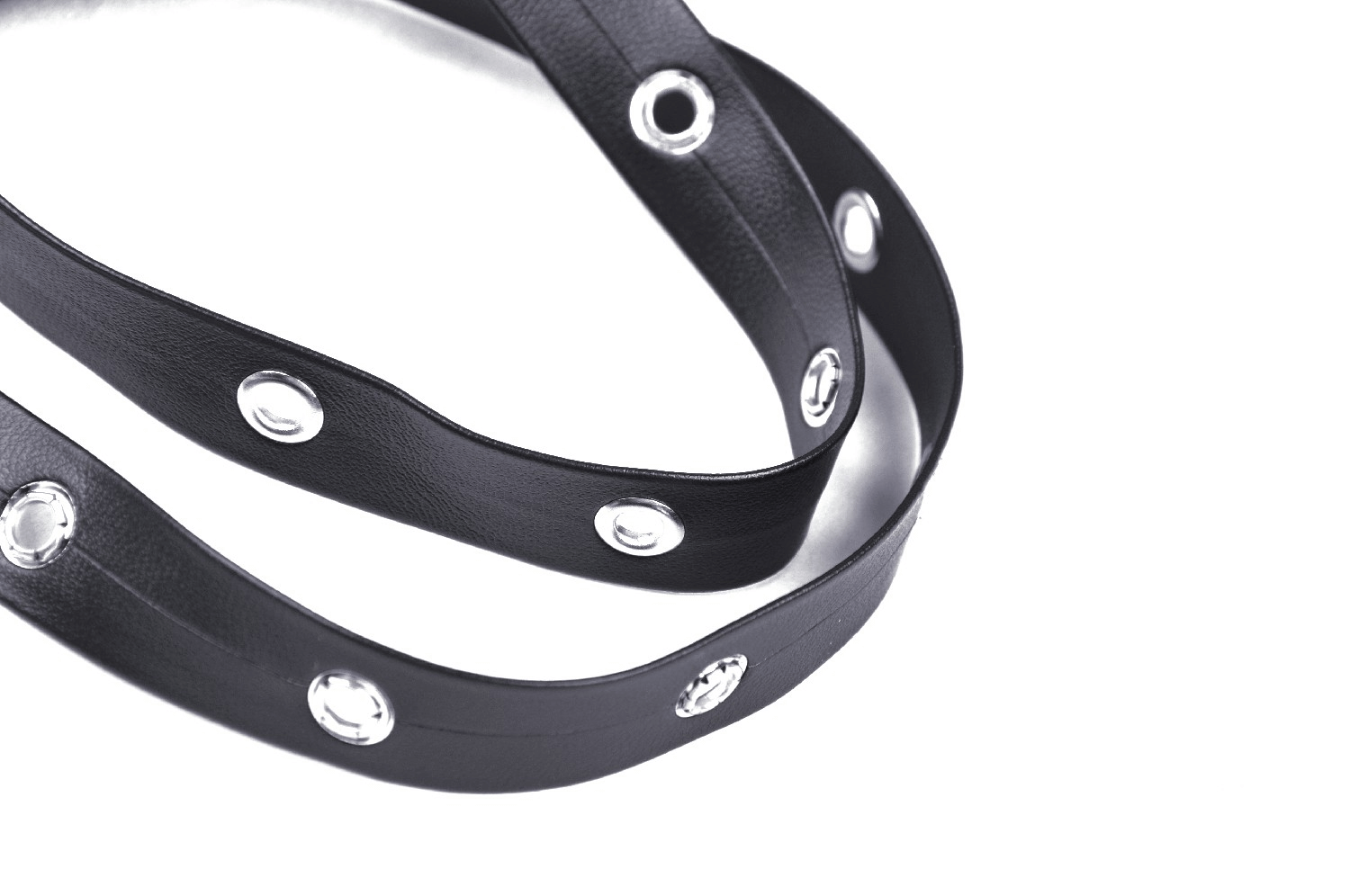 Stylish black leather strap with circular metal embellishments, perfect for adding flair to any outfit.