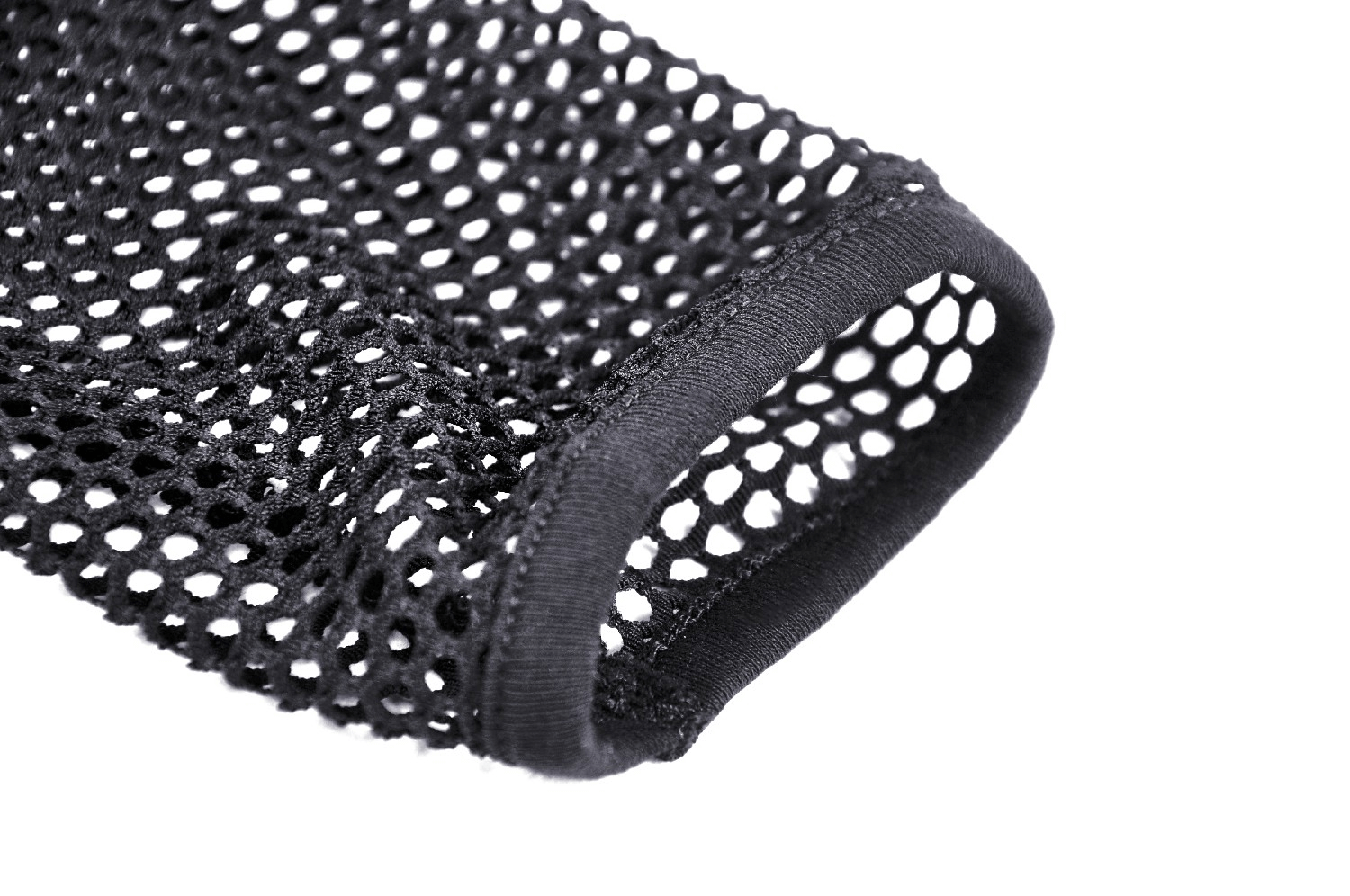 Close-up of the sleeve hem of a black sheer mesh long-sleeved top, showcasing its fishnet design.