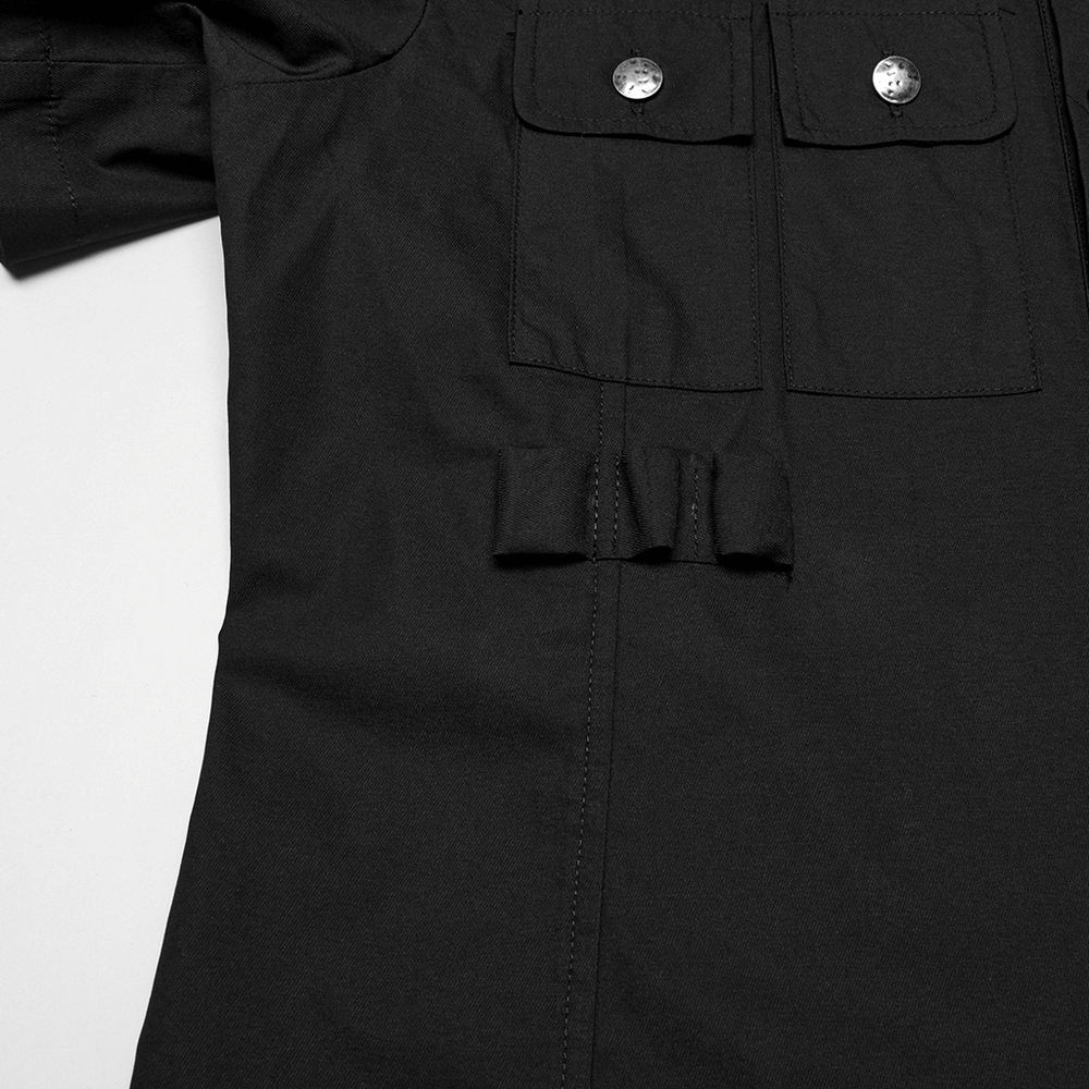 Close-up of black short sleeve punk shirt with eyelet pocket detail and structured lines, perfect for gothic style.