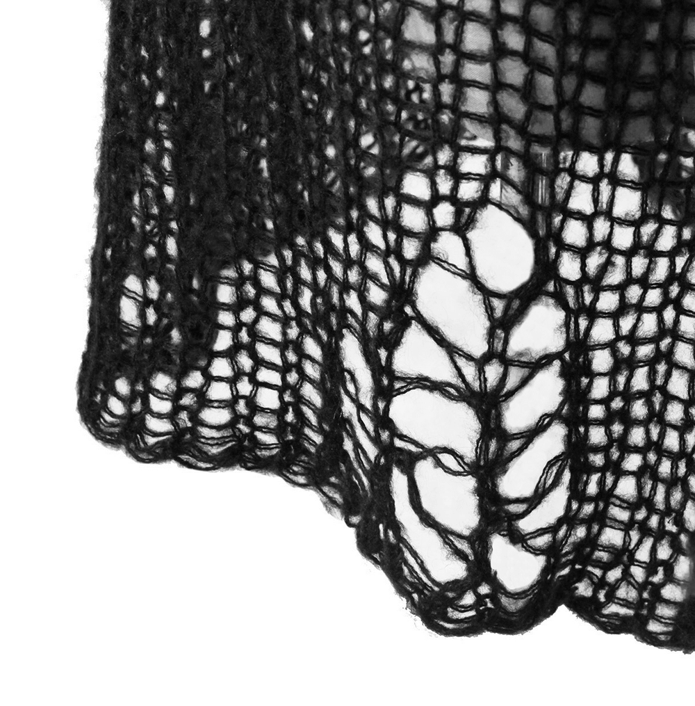 Close-up of black shredded knit crochet fabric showcasing edgy, loose-knit texture and large holes for a grunge-inspired look.