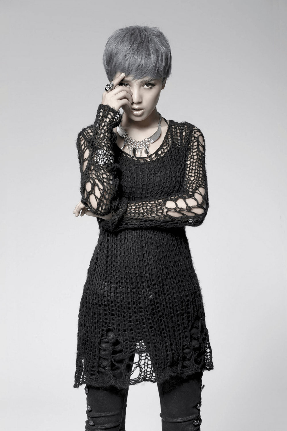 Black shredded knit crocheted sweater with long sleeves, perfect for an edgy, punk-inspired look.