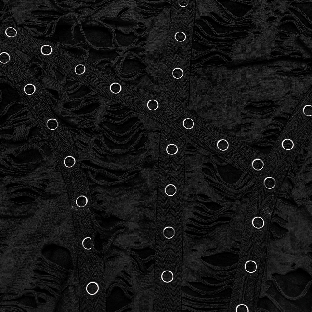 Close-up of black shredded fabric with grommet details and textured patterns for punk fashion.
