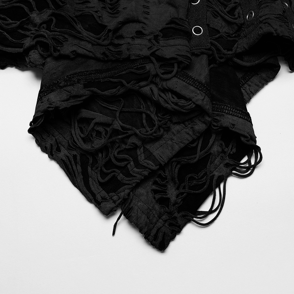 Close-up of black shredded punk mini dress showcasing its tattered texture and unique lace-up details.