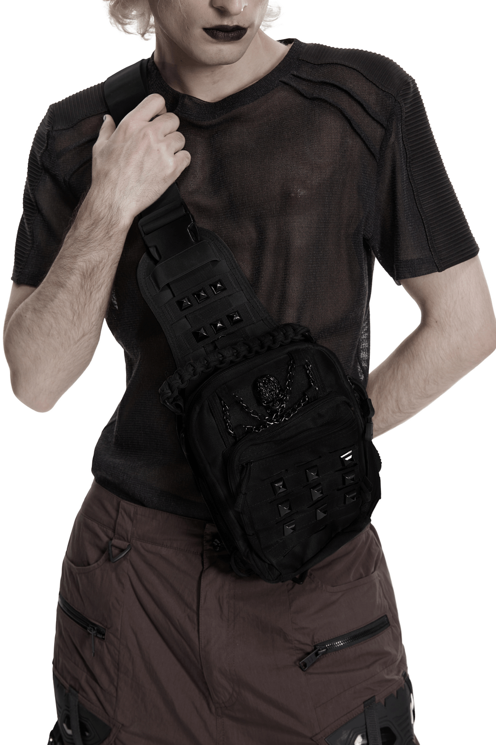 Black Skull Studded Punk Crossbody Backpack Bag worn by a model showcasing its edgy style and design.