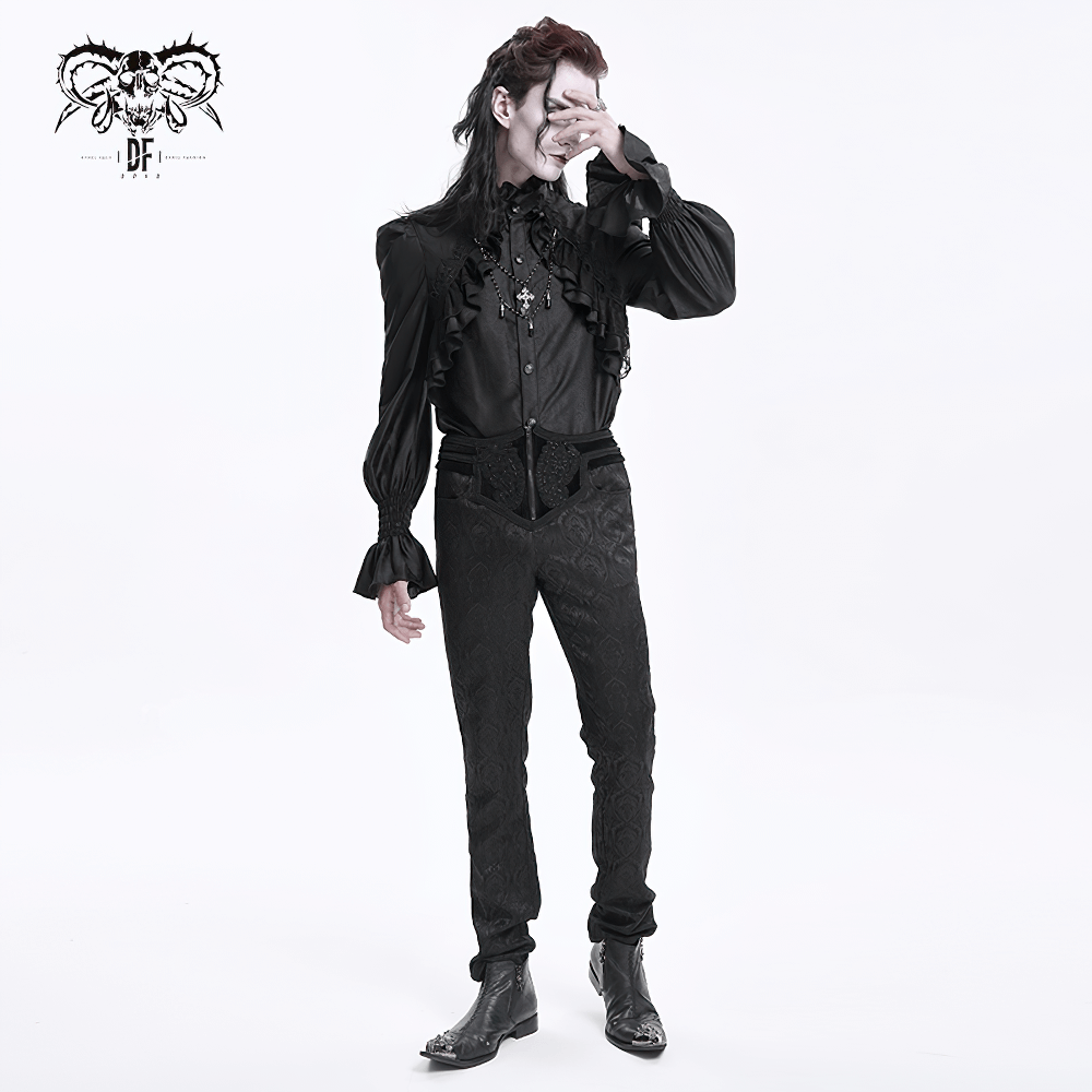 Stylish individual in a black gothic outfit with embossed detailing and ruffled shirt, perfect for a dramatic look.