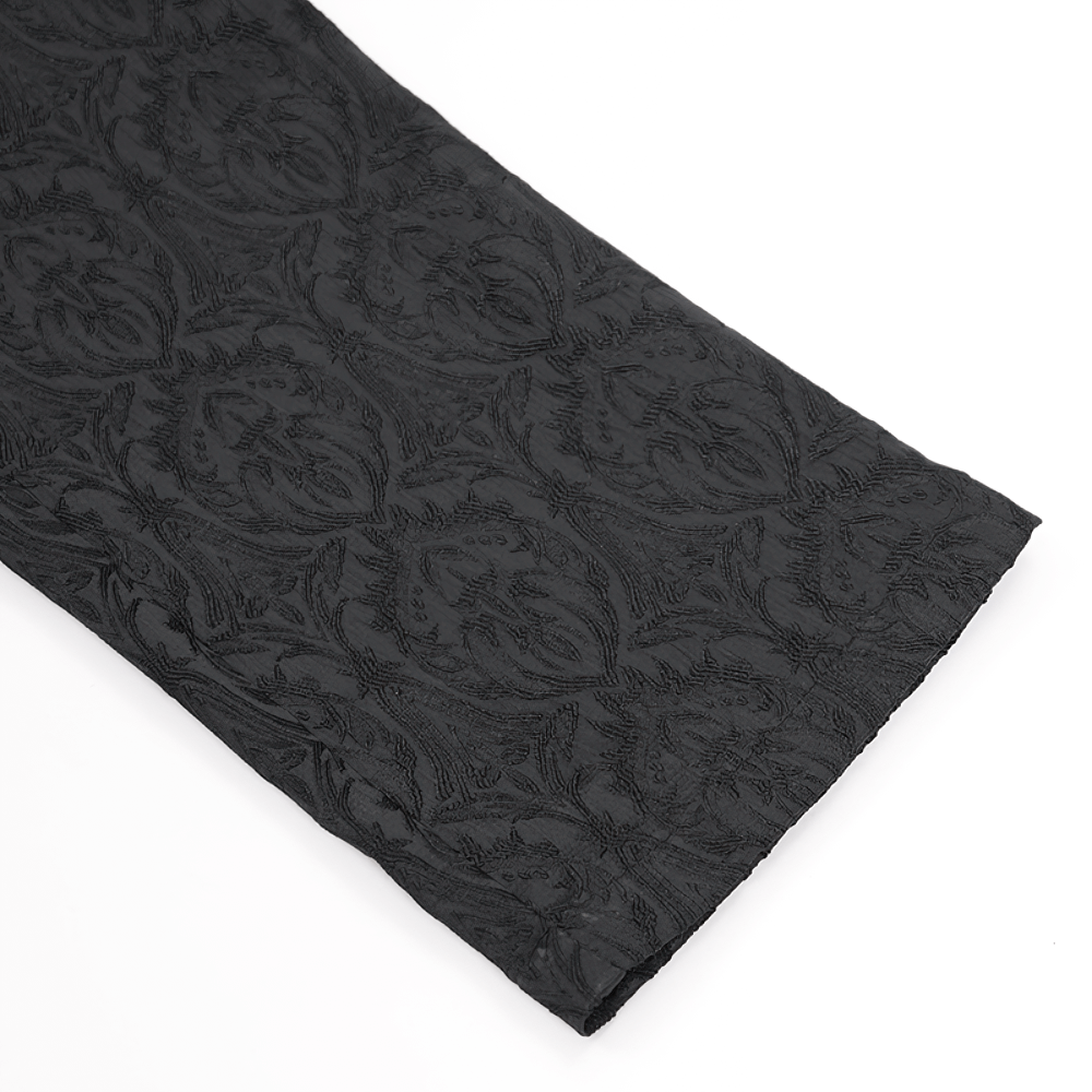 Black slim-fit embossed pants showcasing intricate detailing and soft texture, perfect for stylish autumn outfits.