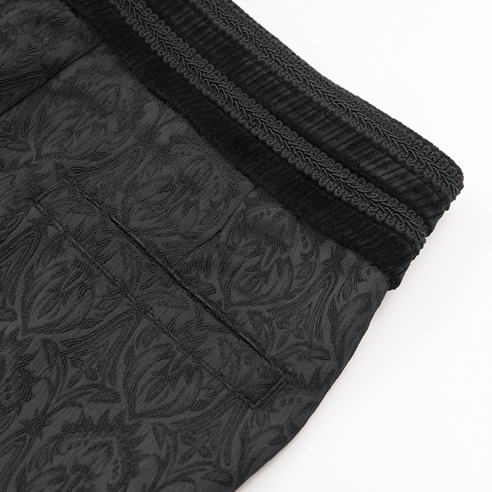 Close-up of black slim-fit embossed pants, showcasing intricate detailing and a soft, textured waistband. Perfect for stylish wear.