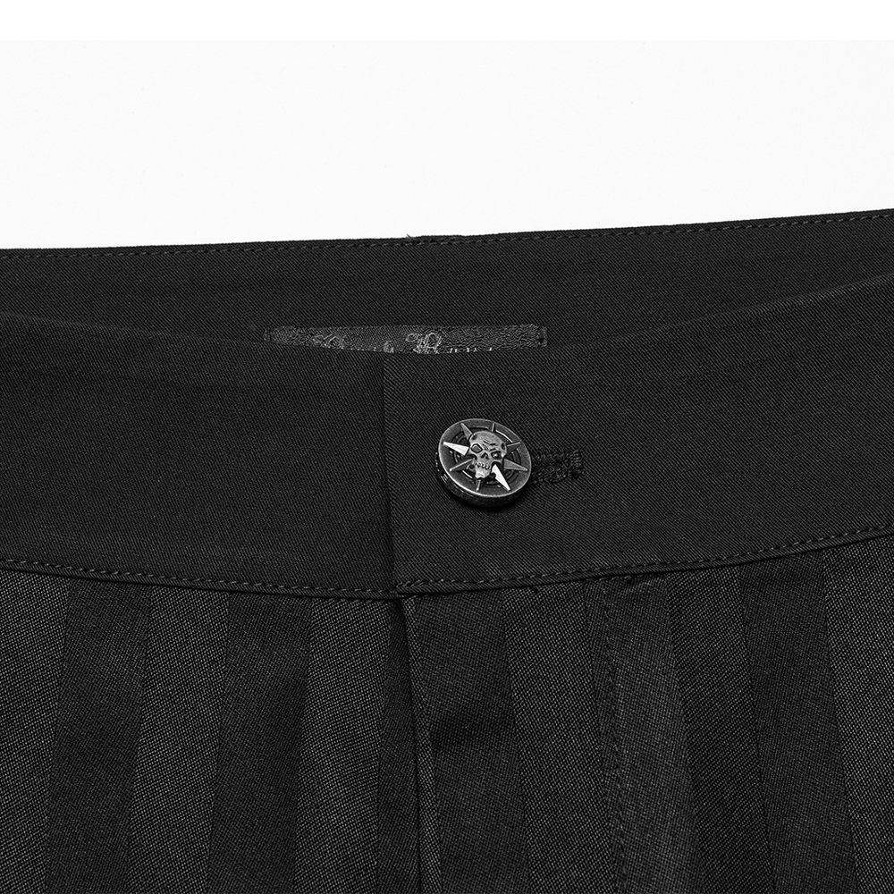 Close-up of black gothic trousers waistband with ornate button detail and subtle striped fabric.