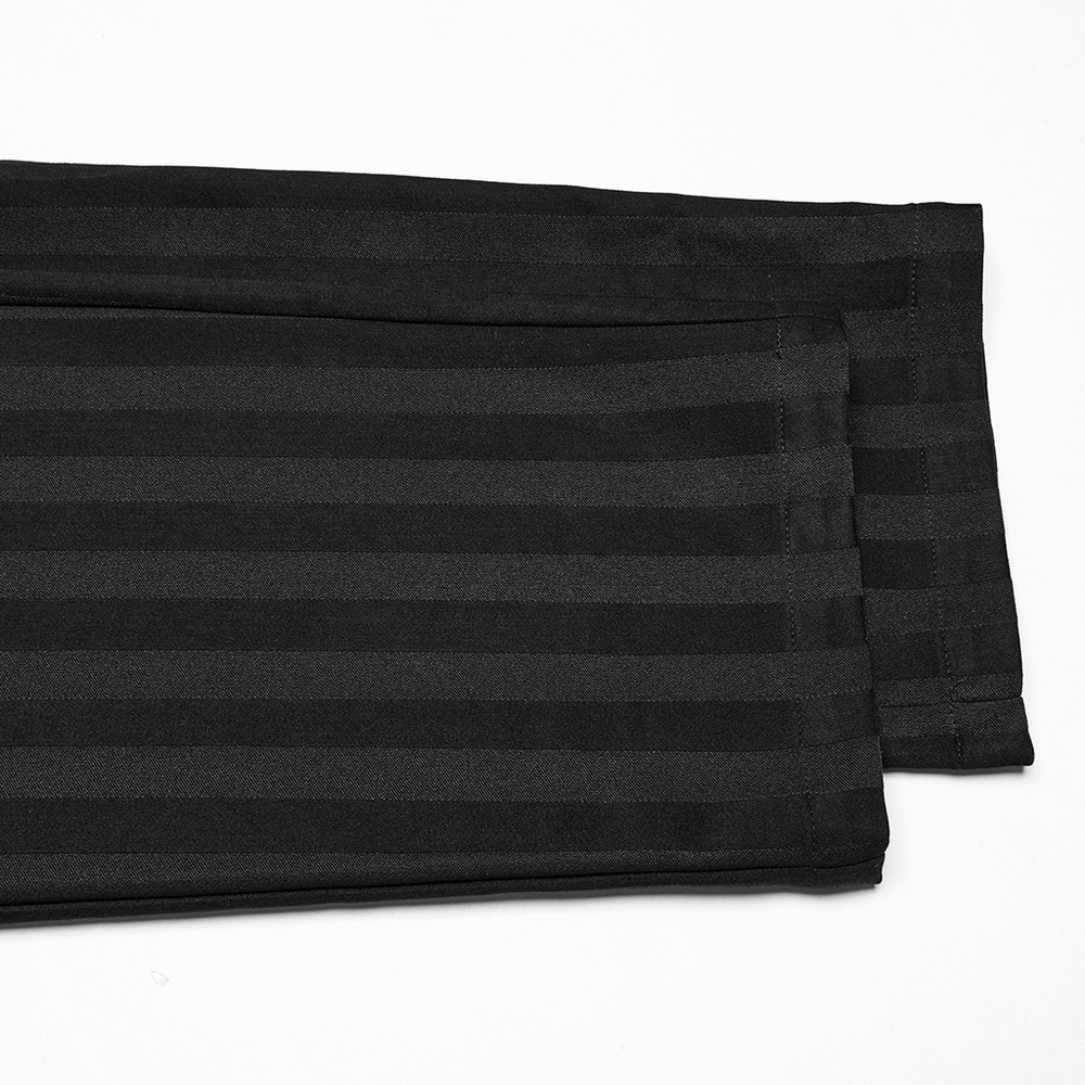 Close-up of black slim fit striped gothic trousers showing subtle stripes and a sleek finish.