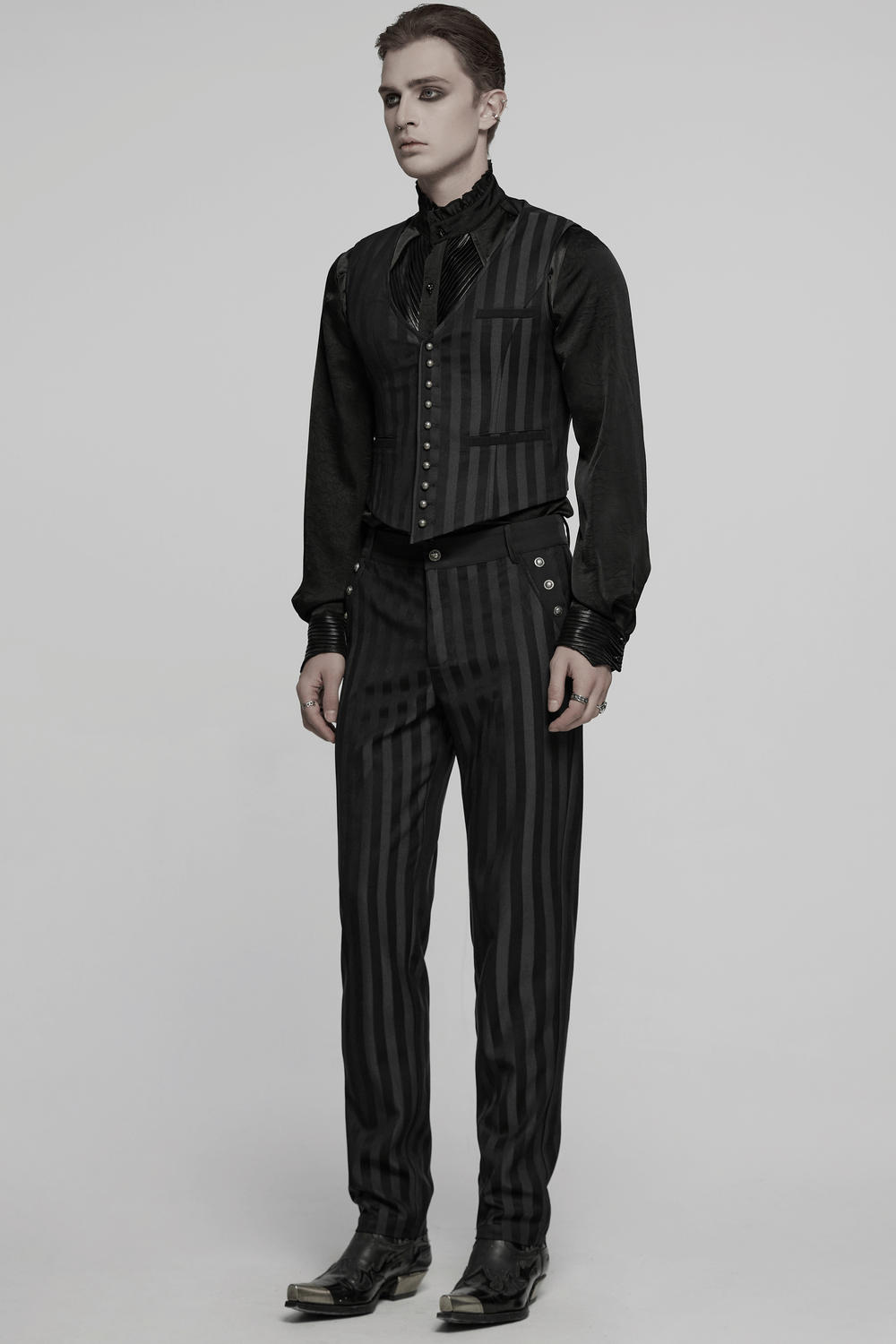 Black slim fit striped gothic trousers for men, featuring ornate buckle details and a sleek silhouette.