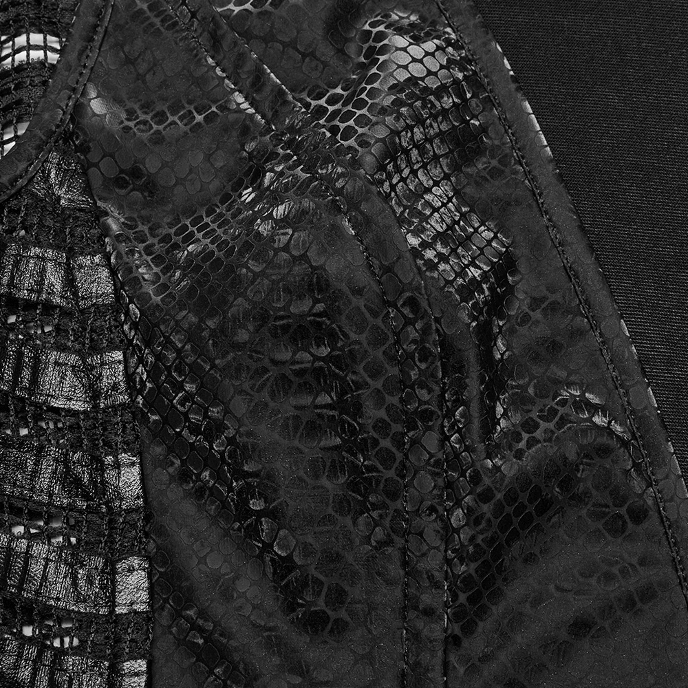 Close-up of black snake print fabric and mesh for punk sleeveless dress with rhinestones.