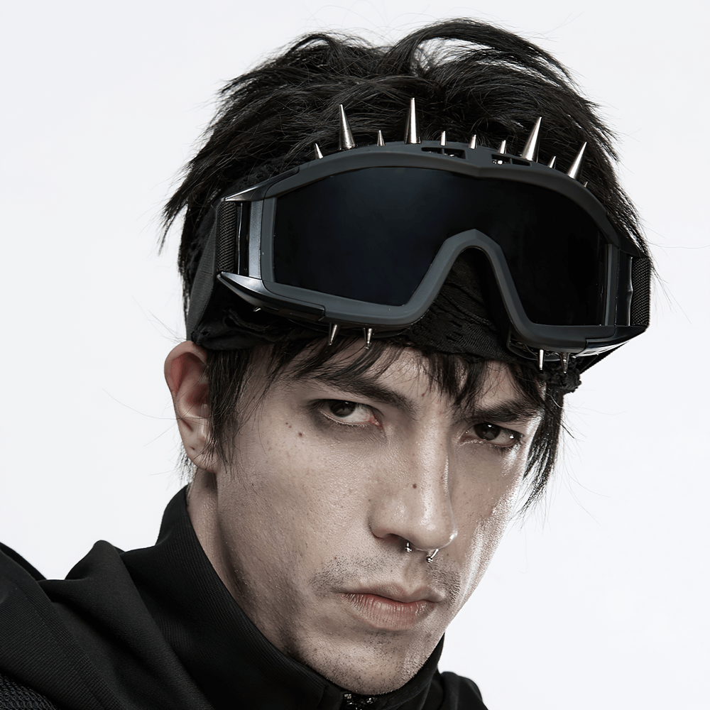 Black spiked punk goggles with adjustable strap, perfect for cyberpunk cosplay and alternative fashion.