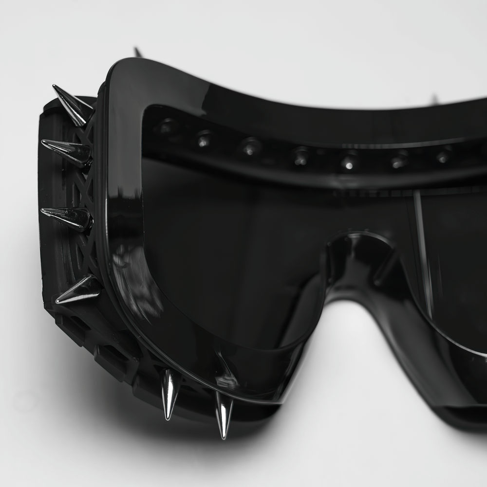 Black spiked punk glasses with futuristic tinted lenses and adjustable strap, perfect for cosplay and alternative fashion.