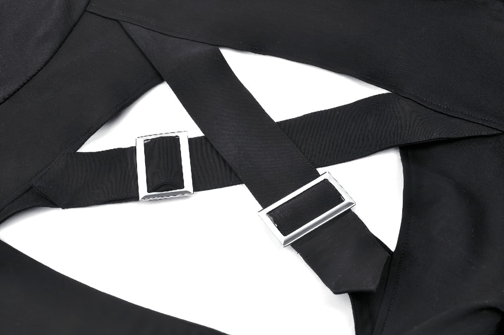 Close-up of black strappy crop top with silver buckle accents and crisscross straps, showcasing gothic style and modern edge.