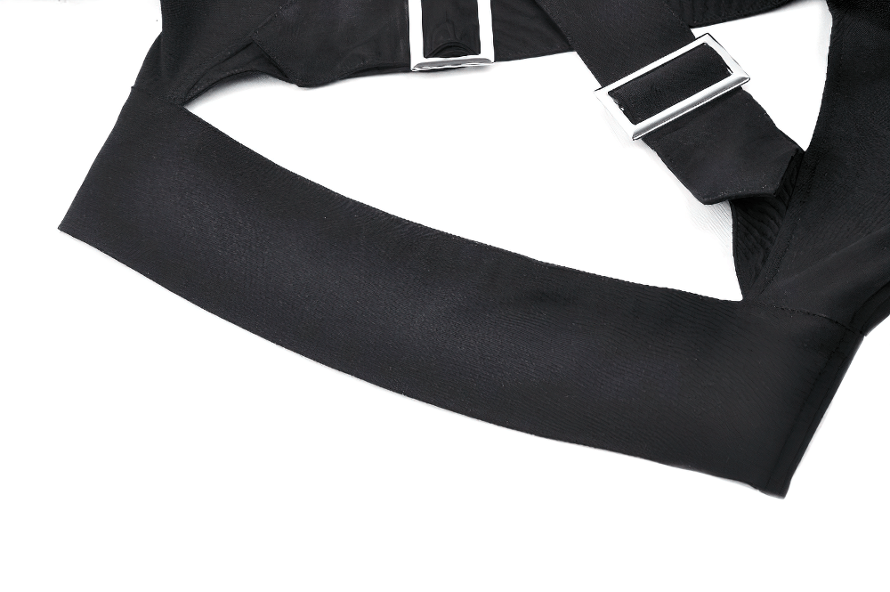 Close-up of black strappy crop top with sleek buckle accents and smooth fabric, showcasing gothic style and edgy design.