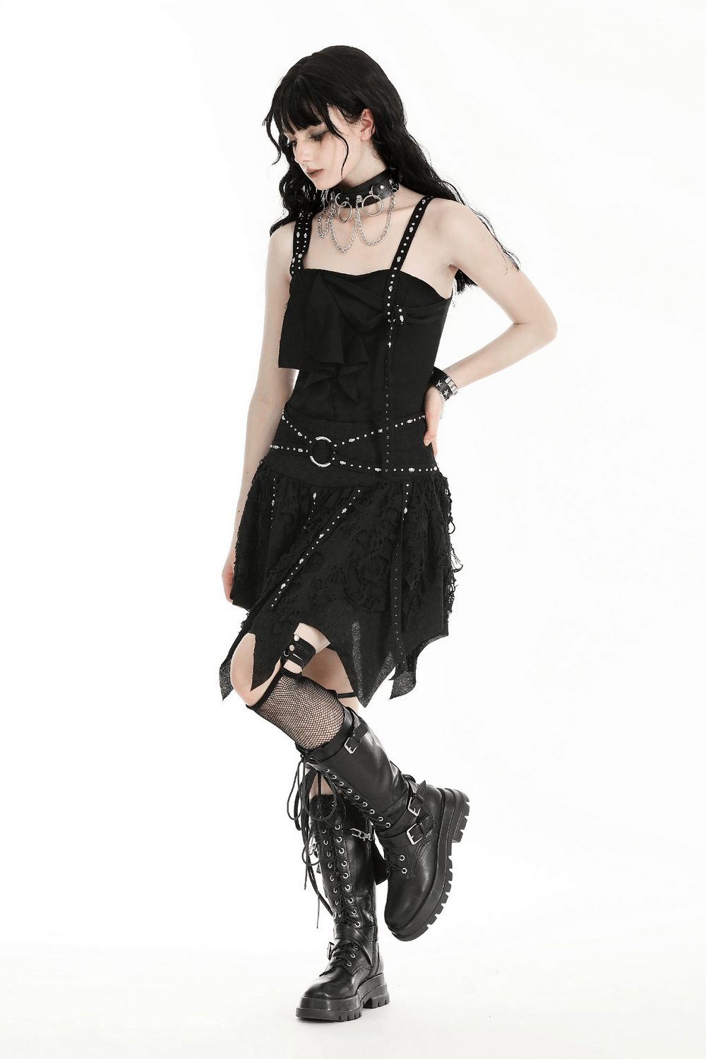 Model showcasing a Black Studded Layered Asymmetrical Gothic Skirt paired with edgy boots and accessories.