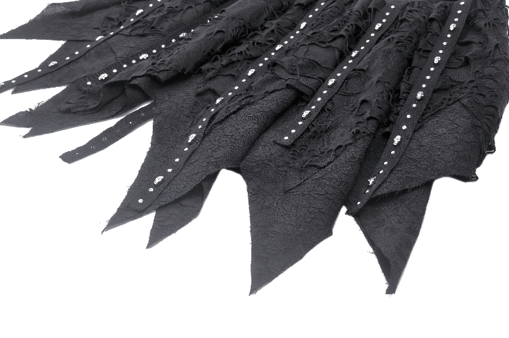 Close-up of a black studded asymmetrical gothic skirt showcasing layered fabric and edgy buckle details.