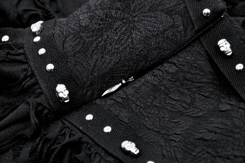 Close-up of black gothic skirt showcasing intricate buckle and studded details, perfect for bold fashion statements.
