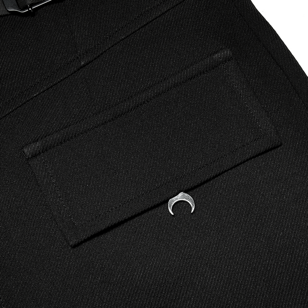 Close-up of black cargo shorts pocket featuring unique crescent moon hardware detail.