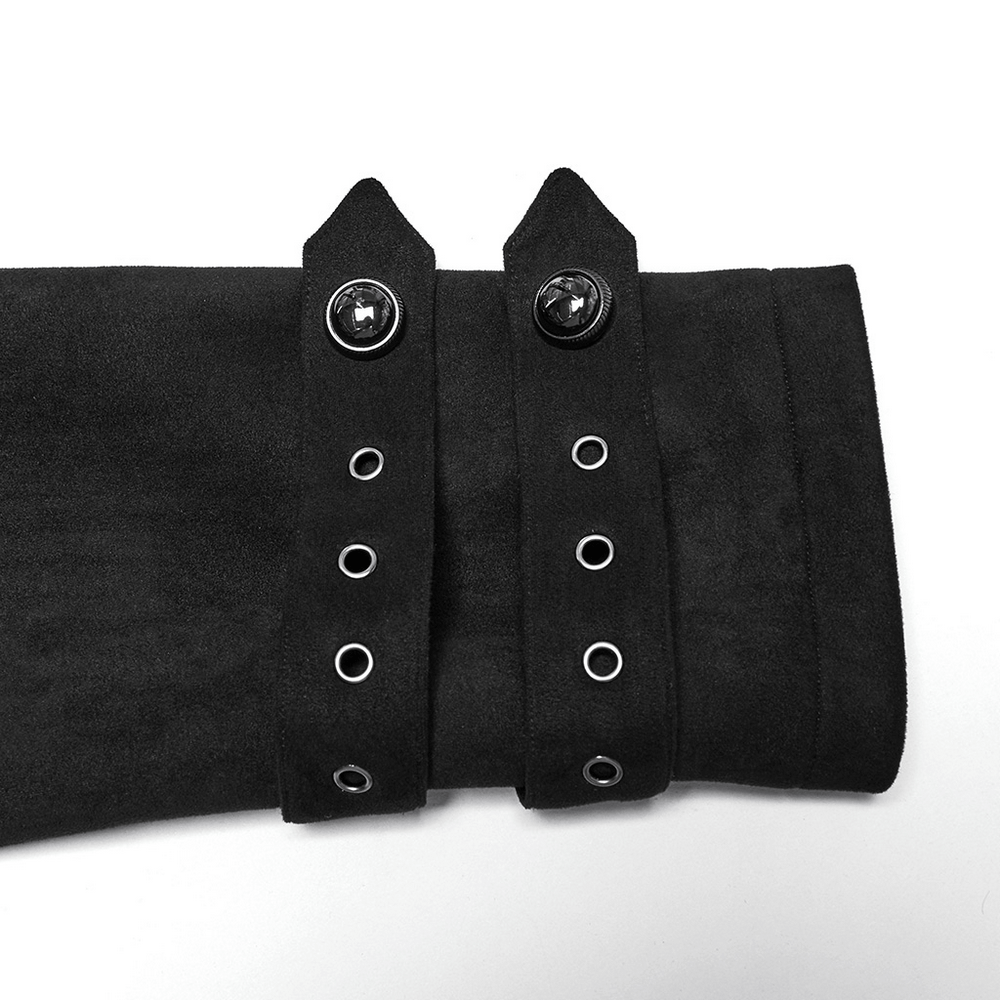 Close-up of decorative buckles and loops on a black suede gothic coat, showing fine detailing and adjustable features.