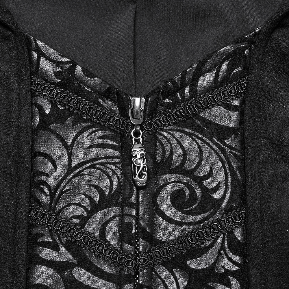 Close-up of ornate black gothic coat zipper, featuring decorative chain detailing and elegant jacquard patterns.