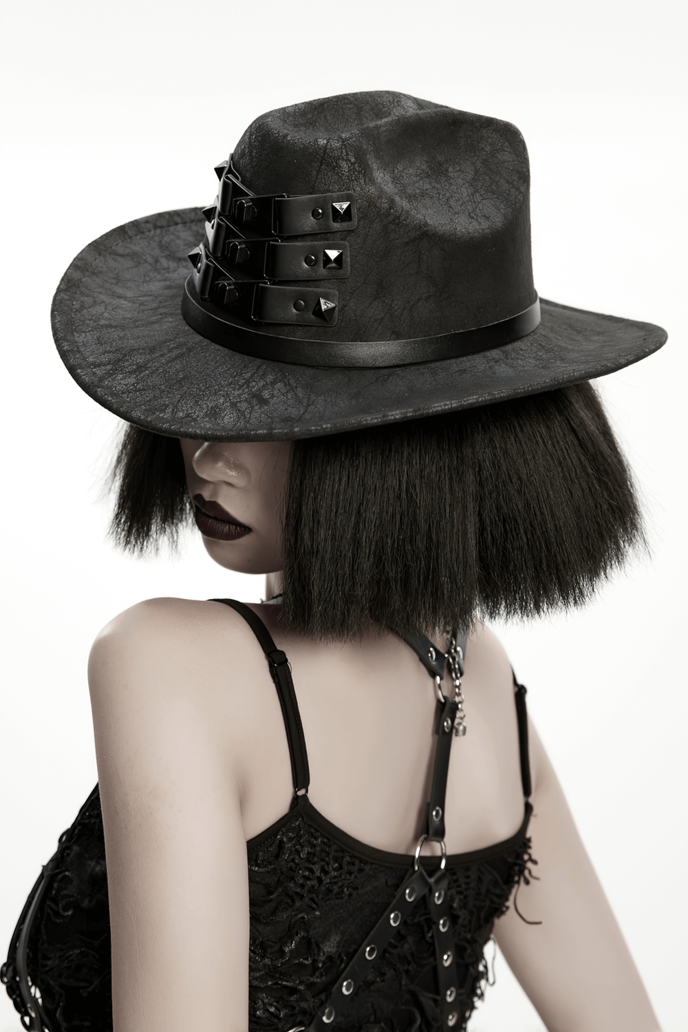 Black suede steampunk hat with triple buckle straps, perfect for gothic and punk fashion enthusiasts.