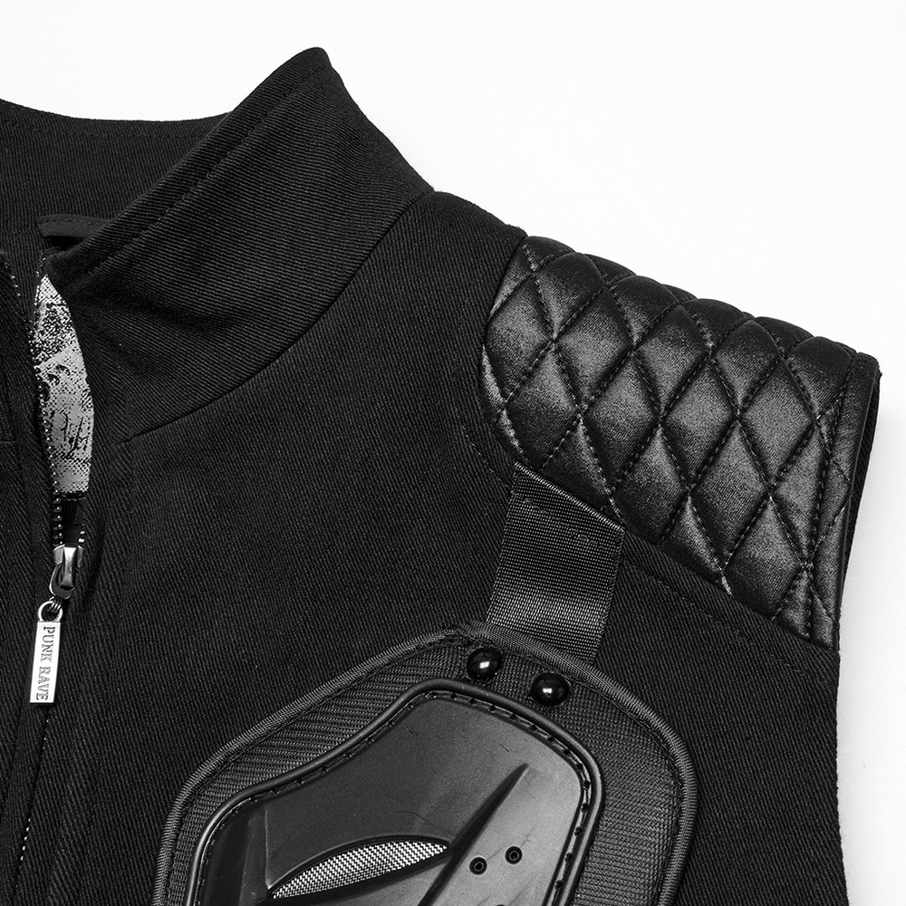 Close-up of black tactical vest featuring glossy rubber armor panel and quilted shoulder design.
