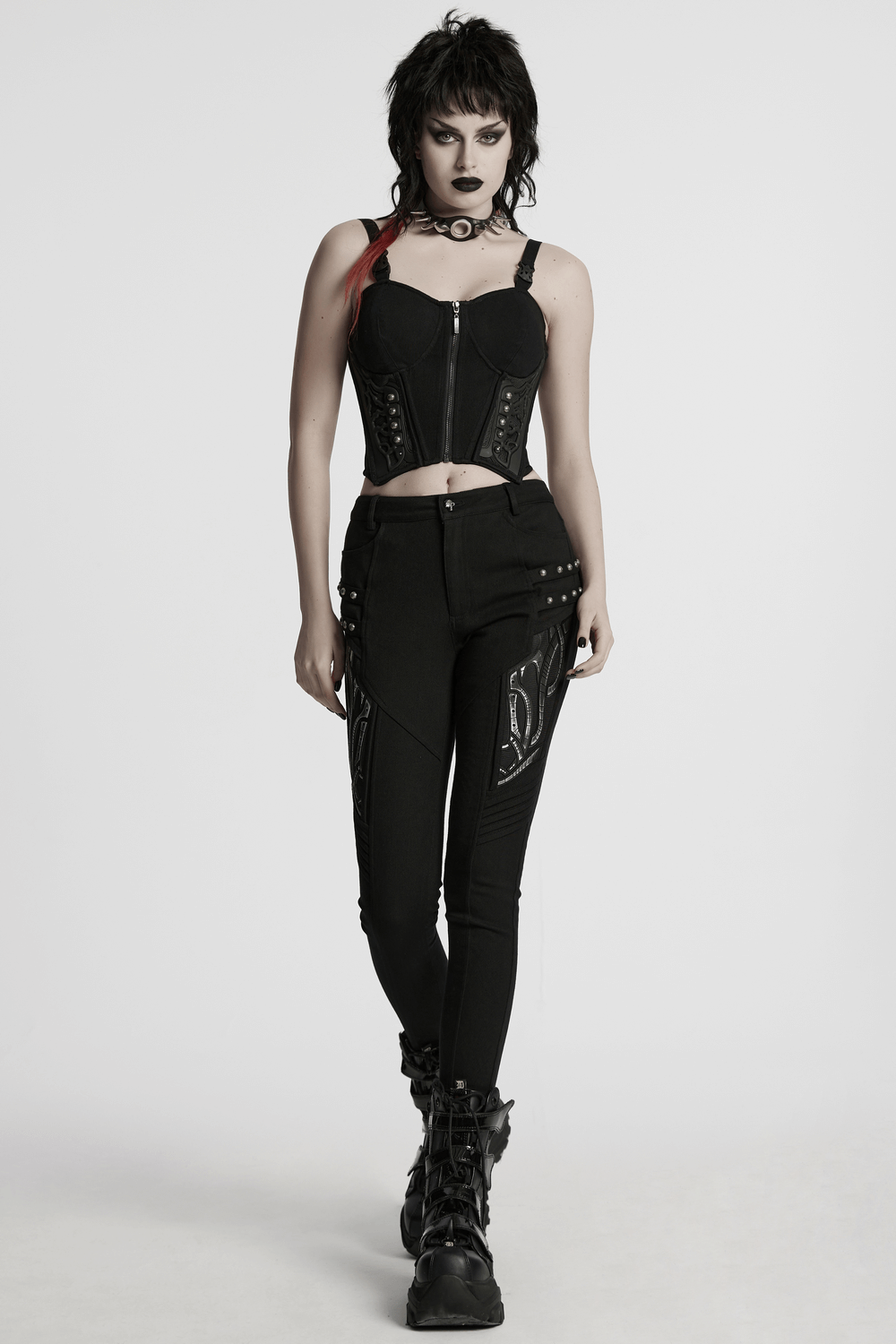 Black techwear trousers with rubber patch details, perfect for a stylish and edgy look.