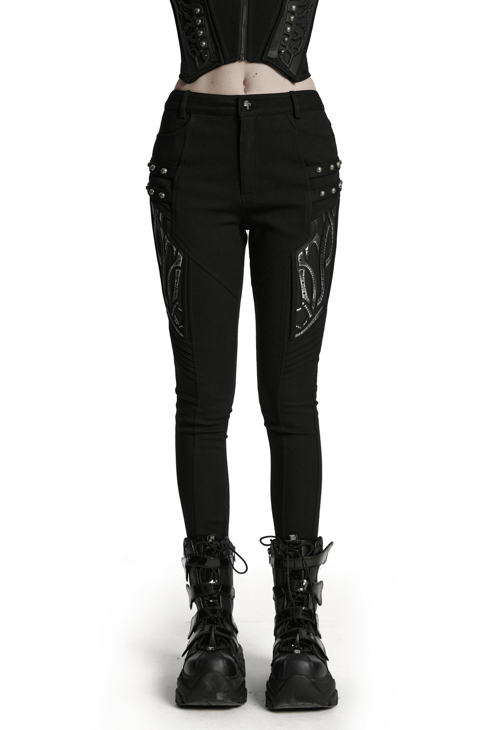 Black techwear trousers with rubber patch details, featuring a sleek design and edgy street style.