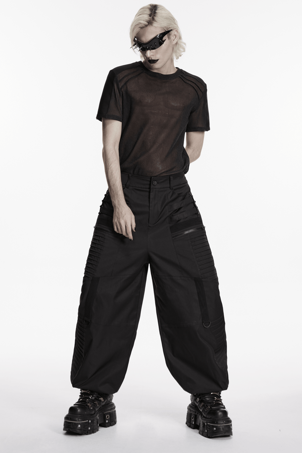 Black Techwear Wide Leg Pants with Pressed Strips styled in a dark, streetwear look with geometric paneling.