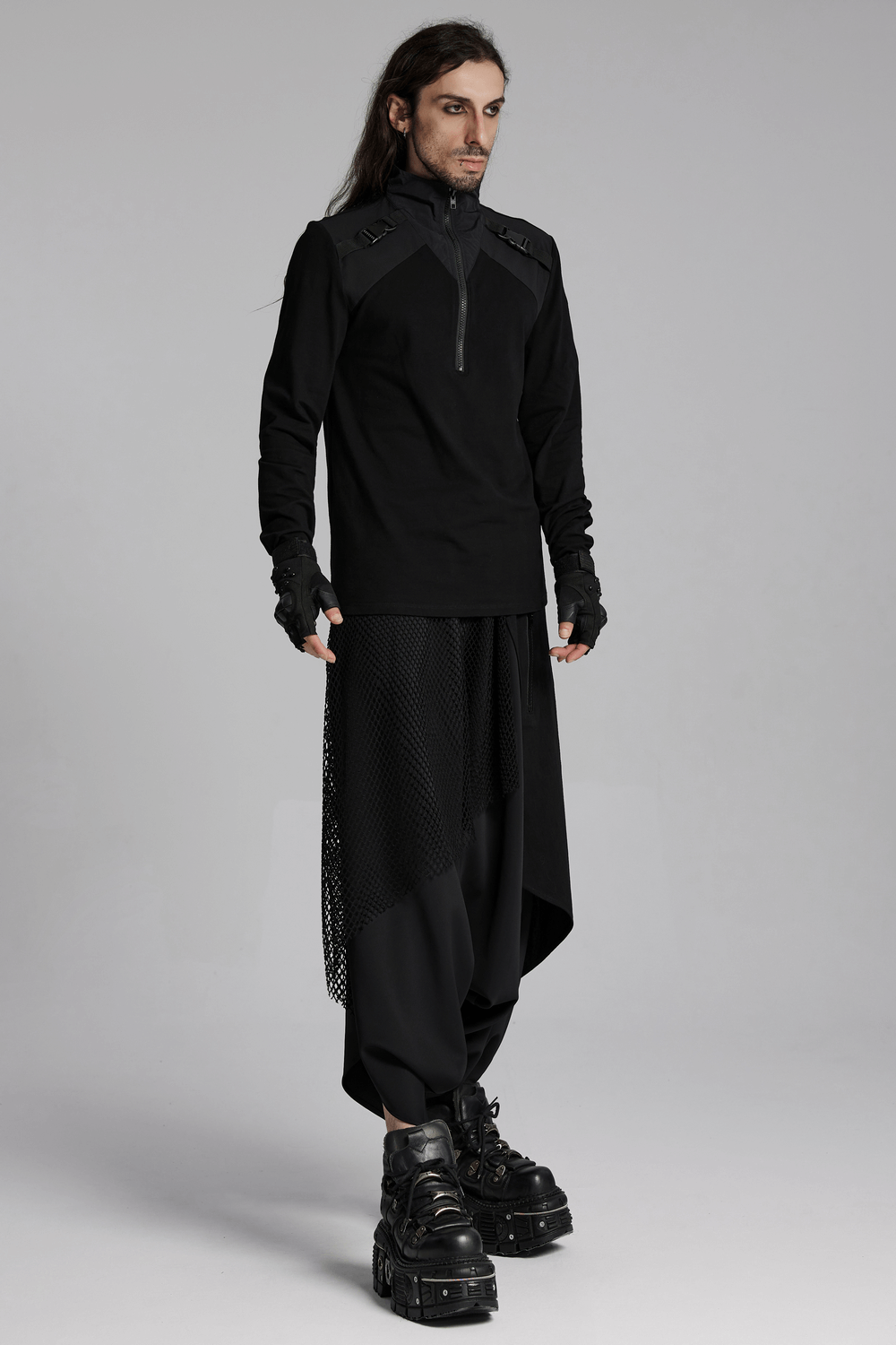 Model showcasing a Black Techwear Zippered Sweatshirt with shoulder buckles, paired with sleek cyberpunk-style pants and boots.