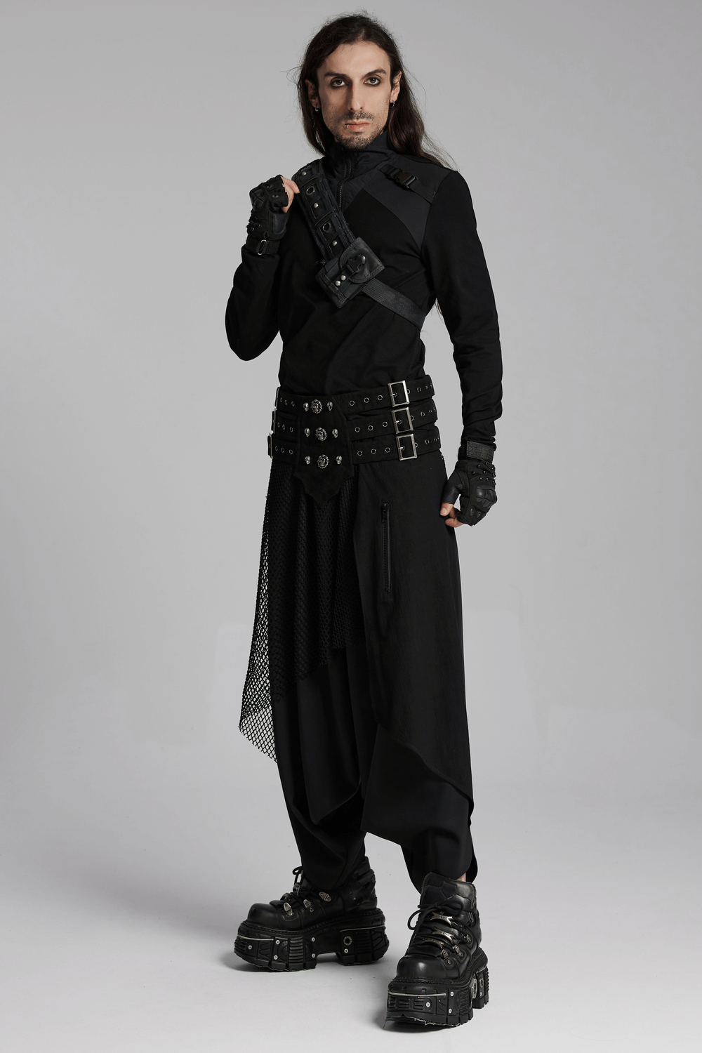 Black techwear outfit with buckles and layered design, showcasing a bold cyberpunk style. Perfect for edgy fashion enthusiasts.