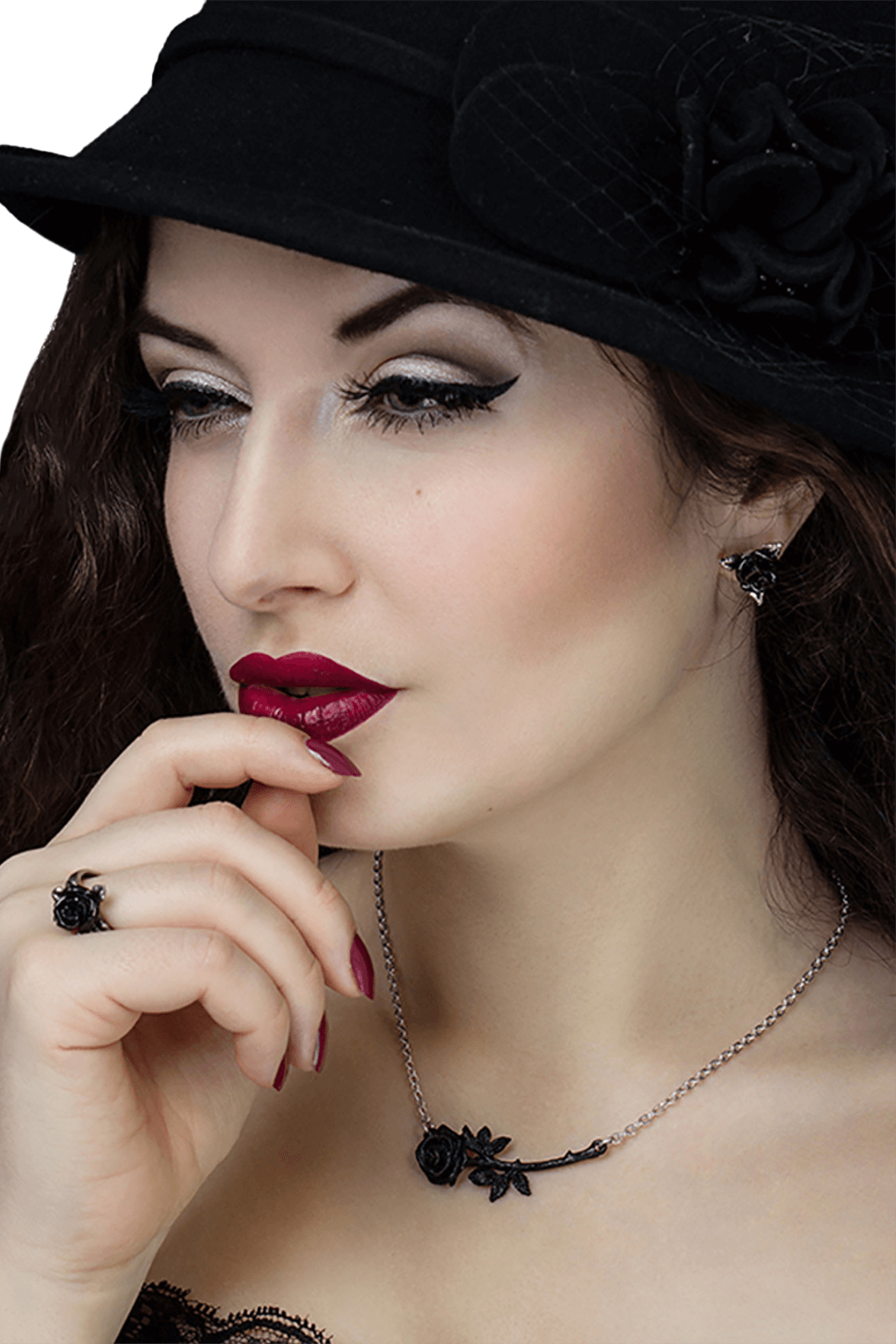 Elegant woman in black hat wearing a Black Thorn Rose Necklace with Swarovski crystals, showcasing gothic style.
