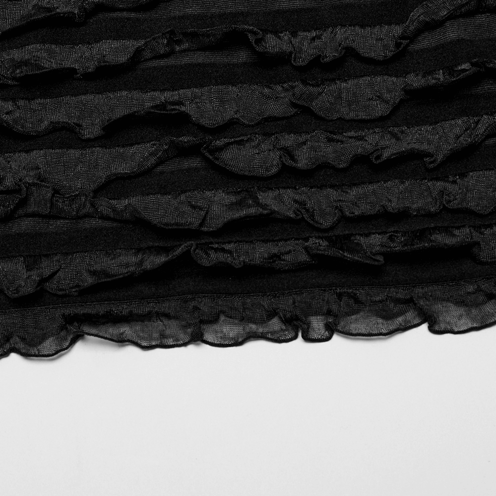 Close-up of black tie-dye ruffled fabric showcasing layered textures and elegant design, perfect for a mini dress.