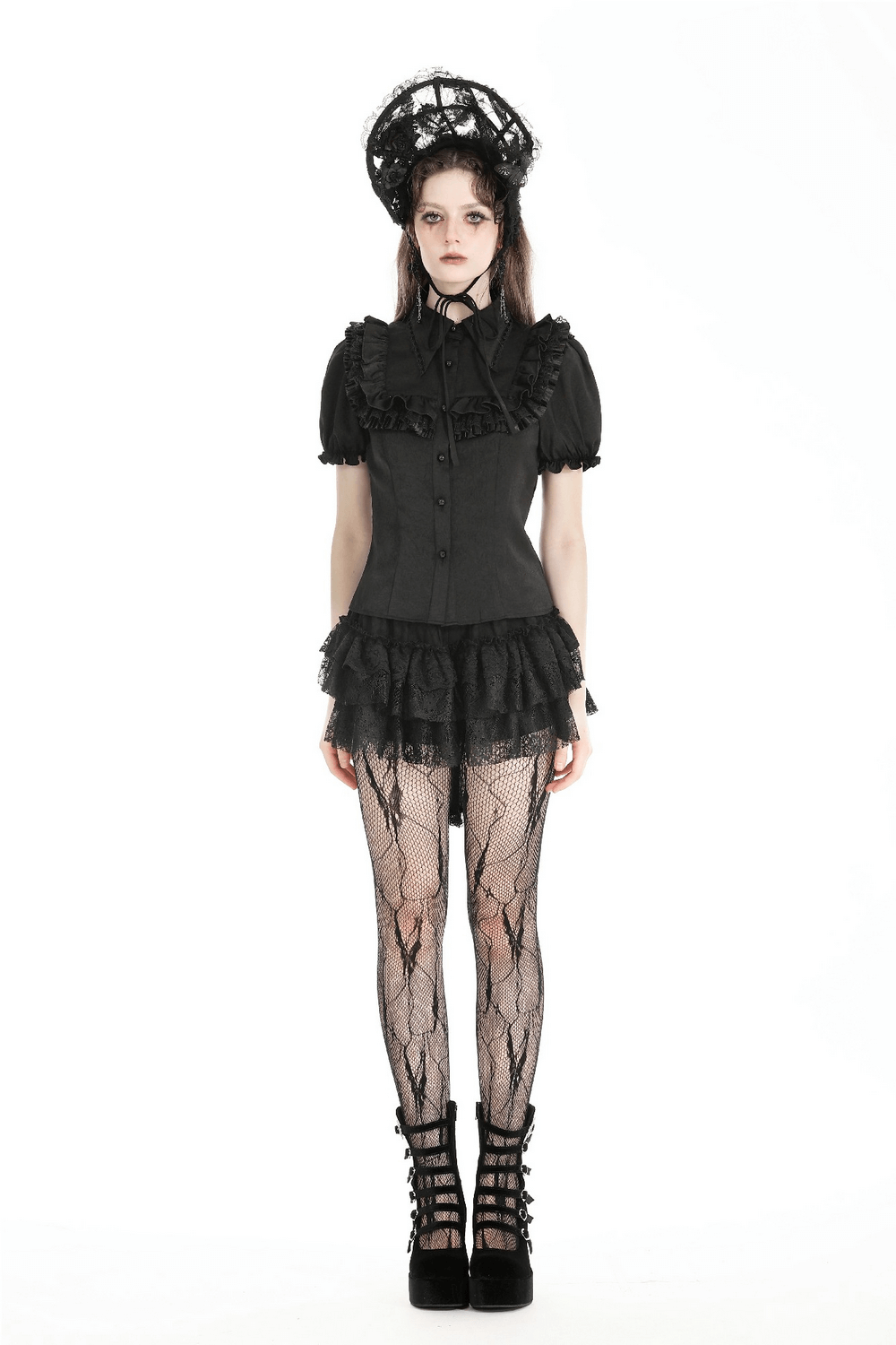 Black Gothic-style dress with ruffles, lace tights, and stylish platform heels for a dramatic look.