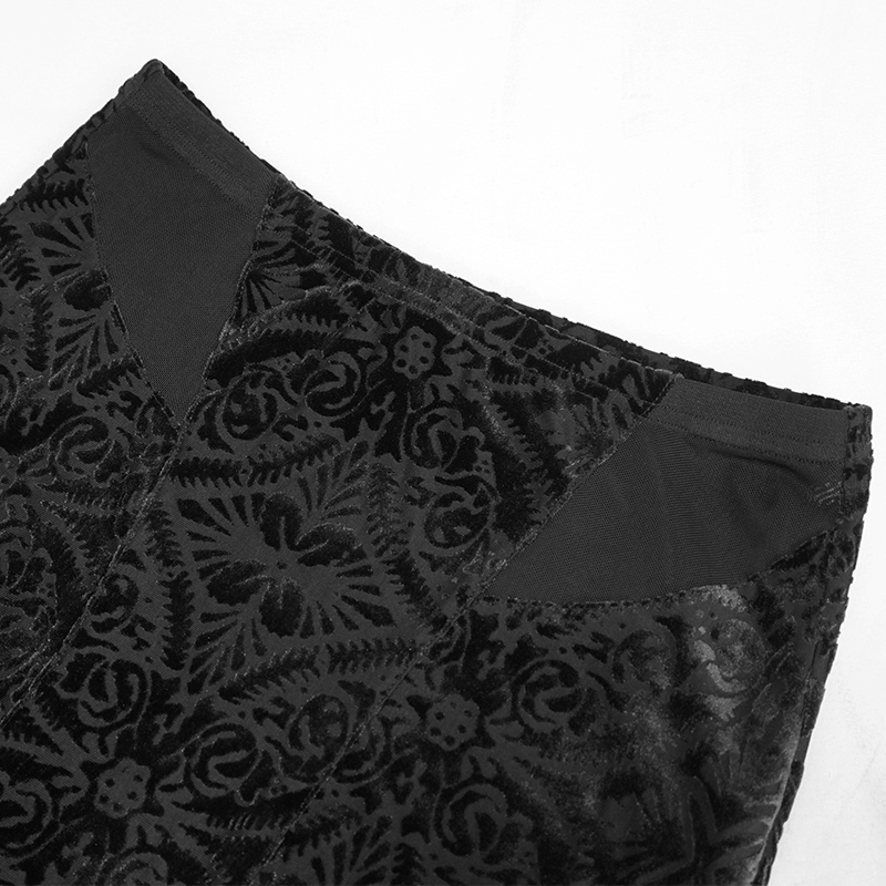 Close-up of the top of a black transparent skirt featuring intricate gothic patterns and trendy design details.