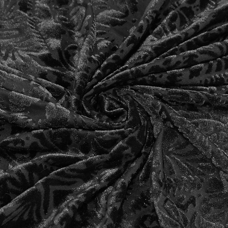 Close-up of black transparent fabric with a gothic floral pattern, perfect for stylish women's skirts.