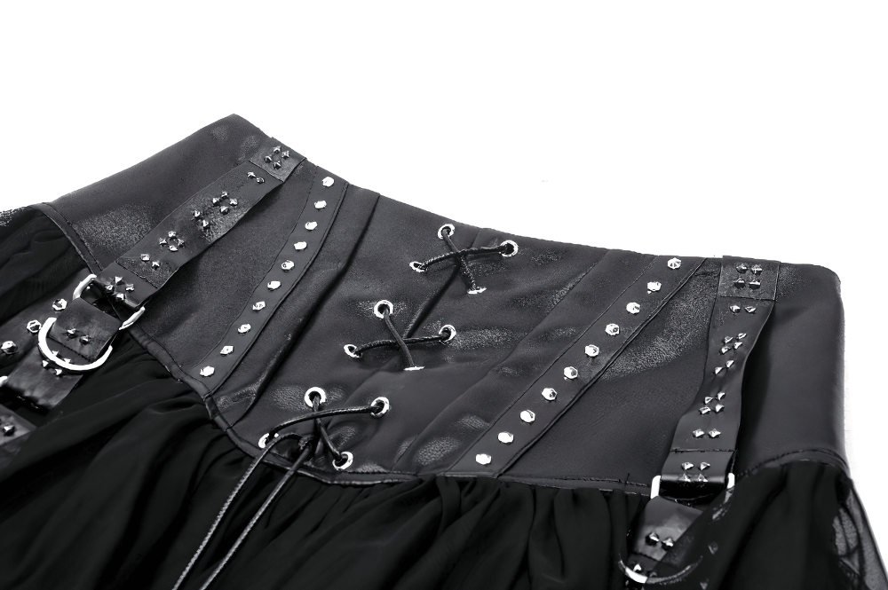 Black tulle mini skirt with lace-up corset and studded detailing, perfect for an edgy rockstar look.