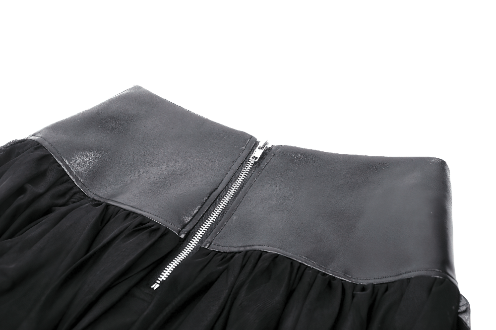 Close-up of the high-waisted black tulle skirt featuring a sleek leather waistband and zipper detail.